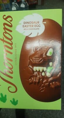 Hollow milk chocolate egg with white chocolate and green coloured decoration